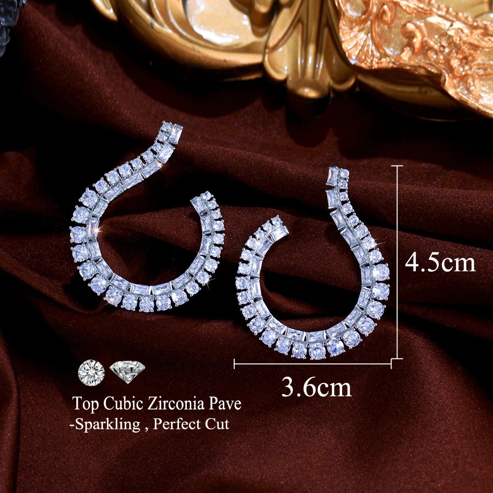 Sculptural Drop Earrings | Designed with a fluid hook shape and brilliant zircon stones