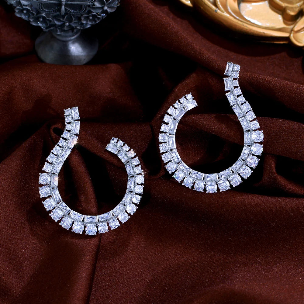 Sculptural Drop Earrings | Designed with a fluid hook shape and brilliant zircon stones