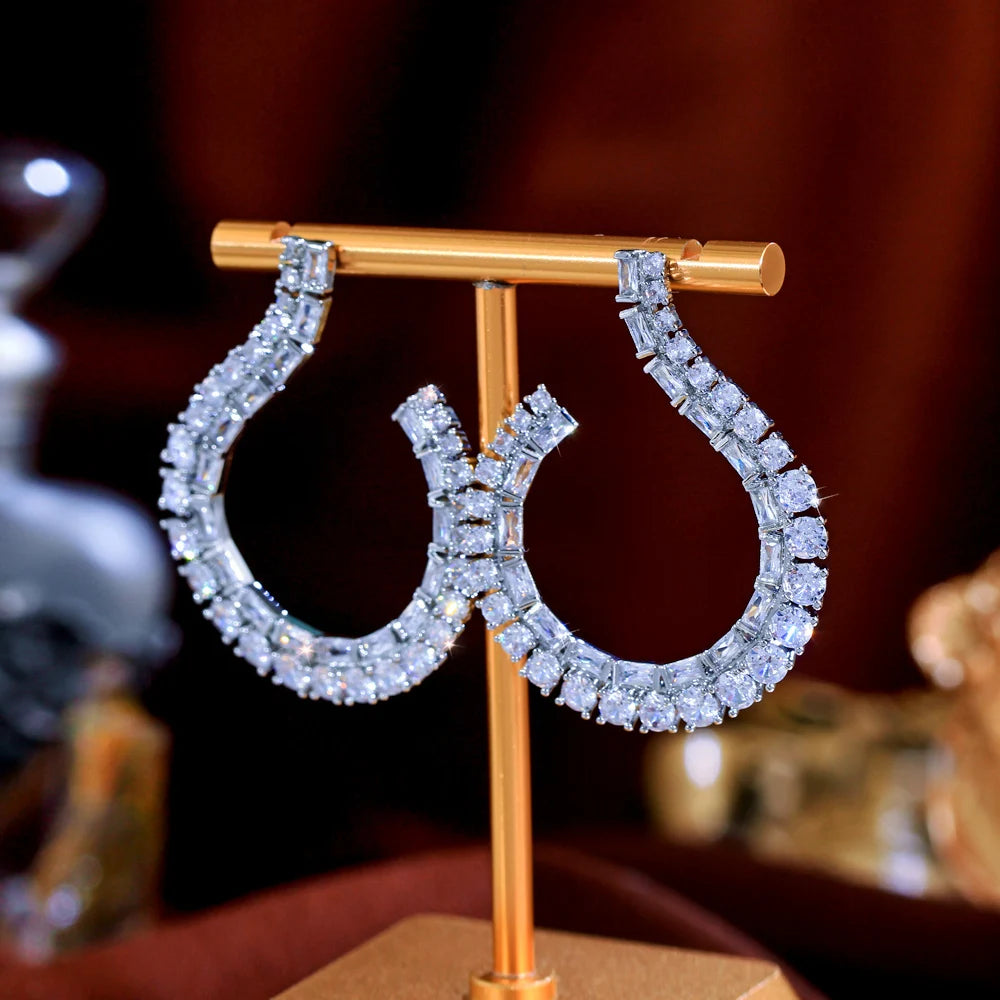 Sculptural Drop Earrings | Designed with a fluid hook shape and brilliant zircon stones