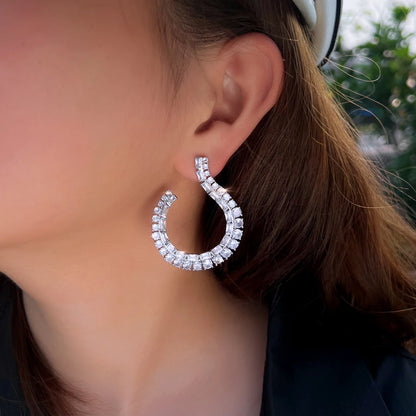 Sculptural Drop Earrings | Designed with a fluid hook shape and brilliant zircon stones