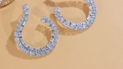 Sculptural Drop Earrings | Designed with a fluid hook shape and brilliant zircon stones